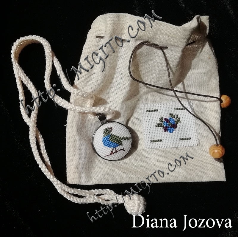 Hand embroidered necklace with bird
