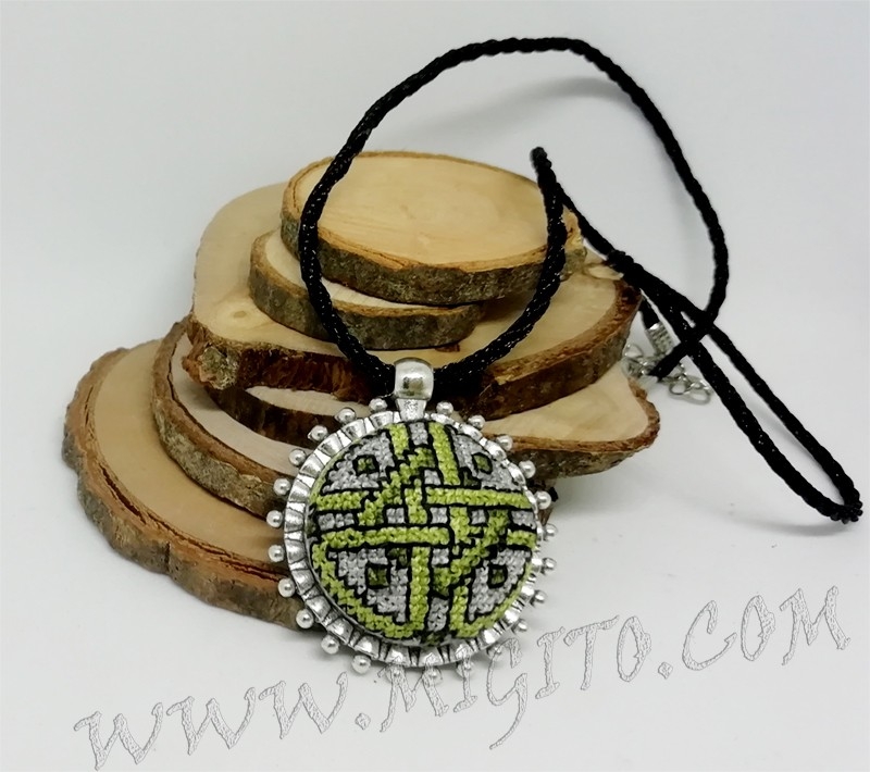 Necklace with embroidery of a green ornament, handmade