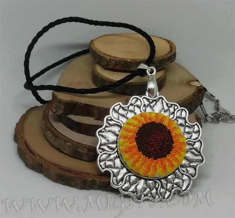 Handmade embroidered sun necklace