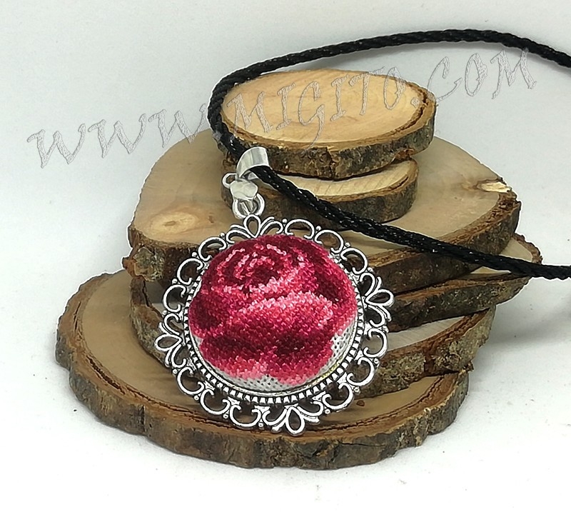 Hand embroidered rose on a necklace