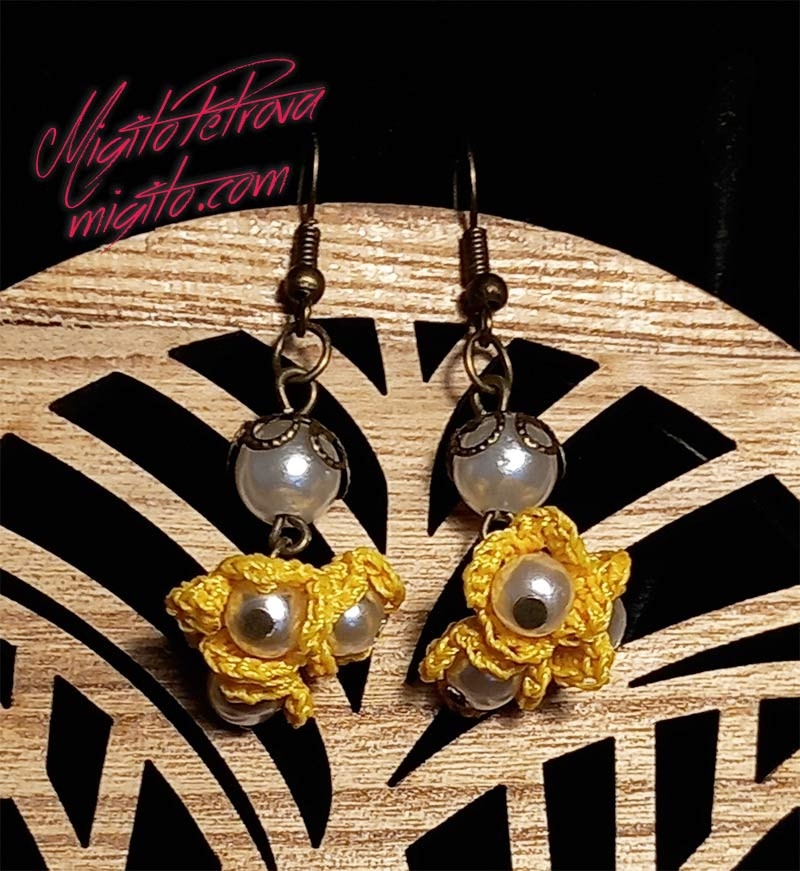 Earrings with small hand-woven yellow flowers